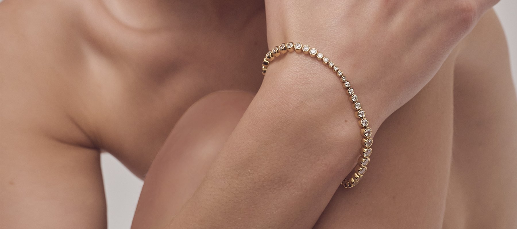 tennisarmbånd i guld med zirkoner